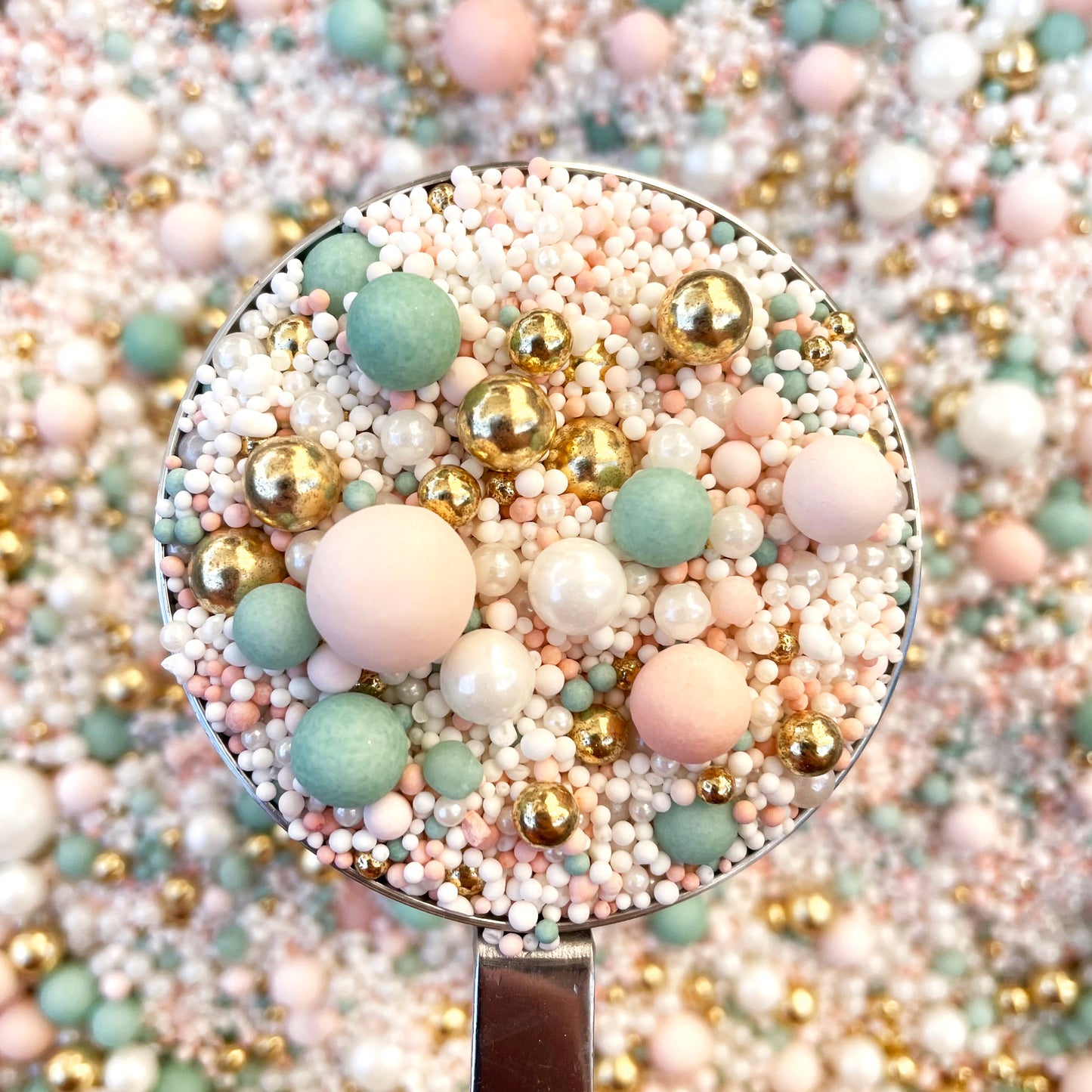 Sage and pink coloured edible cake sprinkles