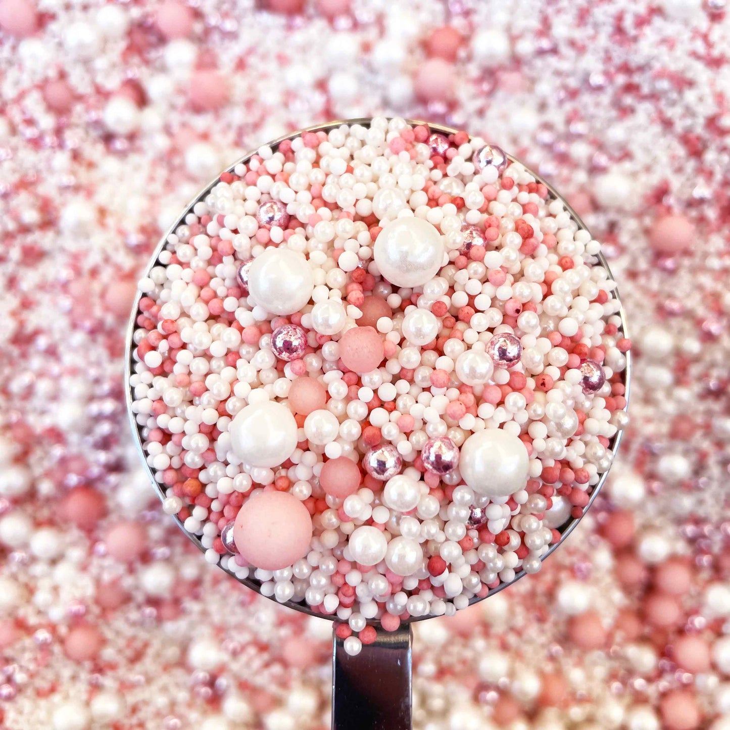 Elegant pale pink and white cake sprinkles